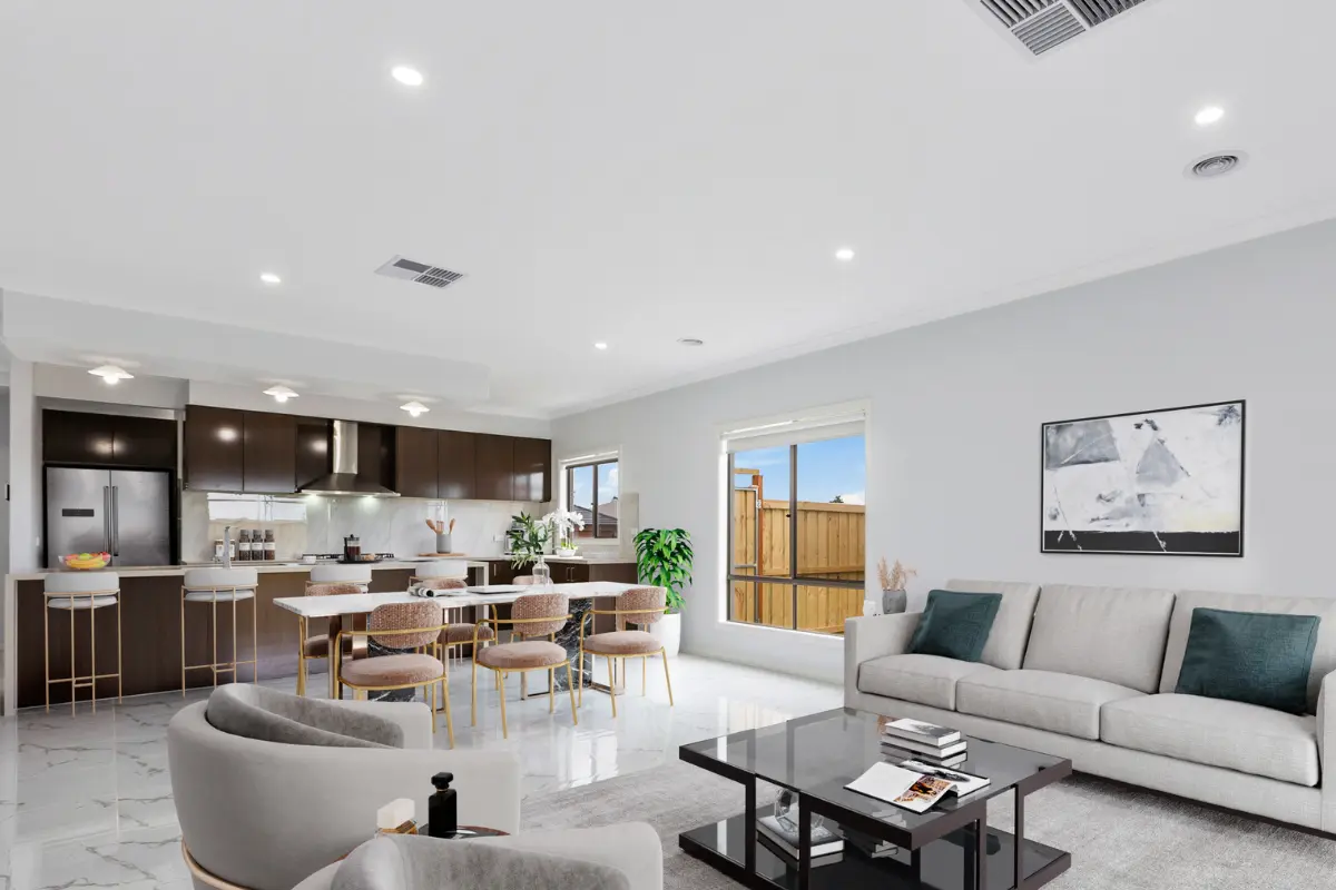 a living room with a table and chairs