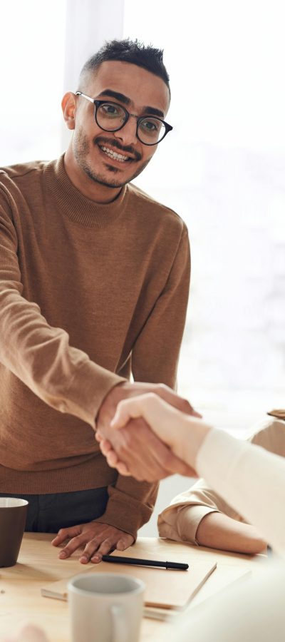 a man shaking hands with another man